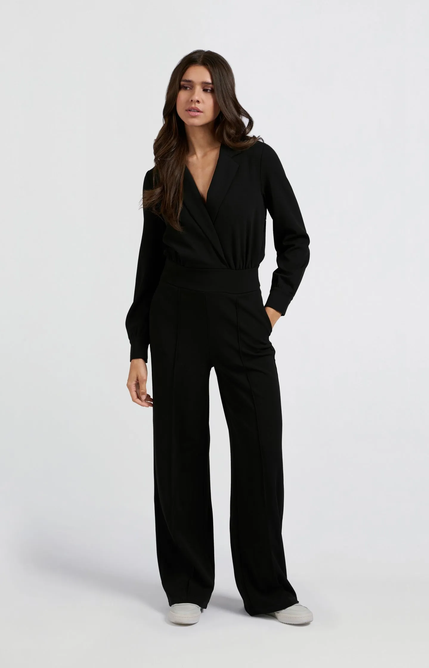 Black jumpsuit with long sleeves and wide legs